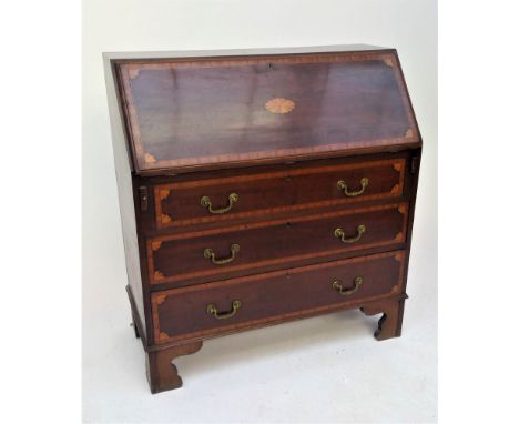 A George III style mahogany bureau, with satinwood crossbanding, the fall front opening to reveal a fitted interior, above th