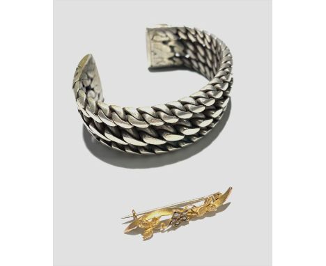 Gold pearl set brooch and a heavy silver Middle eastern bangle
