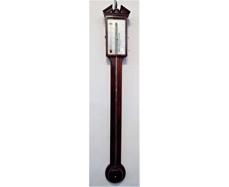 A George III mahogany stick barometer, signed Donegan, Newcastle, length 99cm.