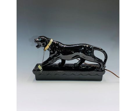 A 1950s Lane &amp; Co. black ceramic lamp in the form of a prowling panther, impressed 'LANE &amp; CO. L.A. CALIF. 1953' to b