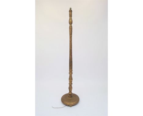 A gilt standard lamp, with raised trailed decoration, height 60cm.