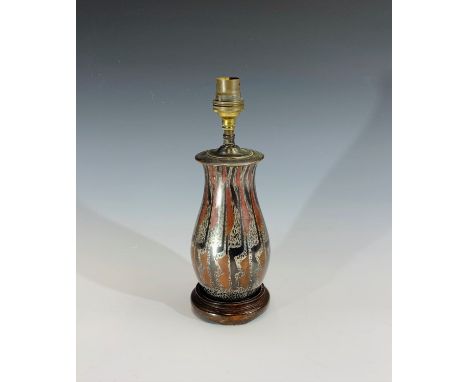 A French Art Deco period mixed metal table lamp of baluster form, on hardwood base. Overall height 26cm.