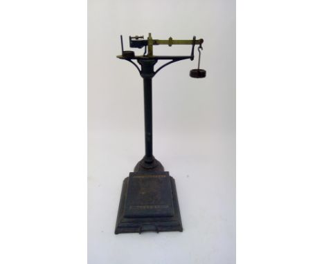 A set of late 19th/early 20th century cast metal medial scales by Mawson &amp; Sons London. Height 92cm.