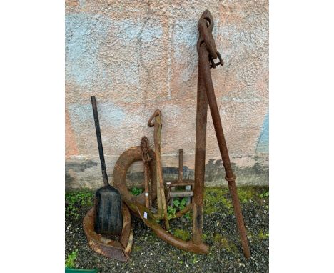A ships anchor with single fluke, length 123cm , two smaller anchors 71 and 55 1/2 cm, a bronze and iron boat line roller, he