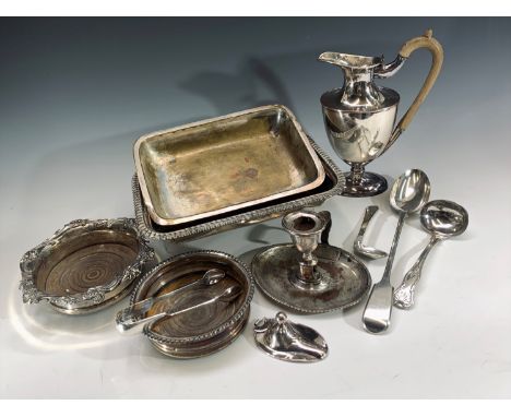A Sheffield plate bottle coaster with floral border, another bottle coaster, hot water jug, chamber candlestick and other sil