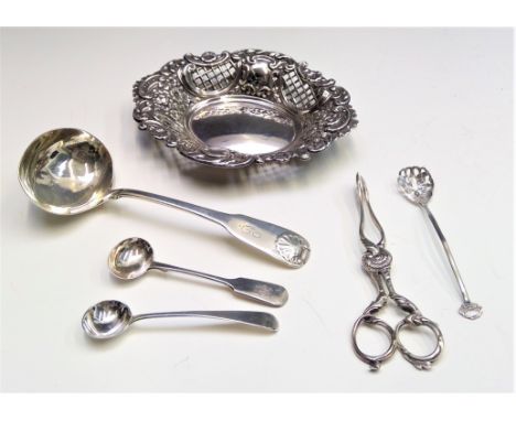 A silver fiddle and shell pattern sauce ladle, three other spoons, a pair of Georgian sugar scissors and a modern silver swee