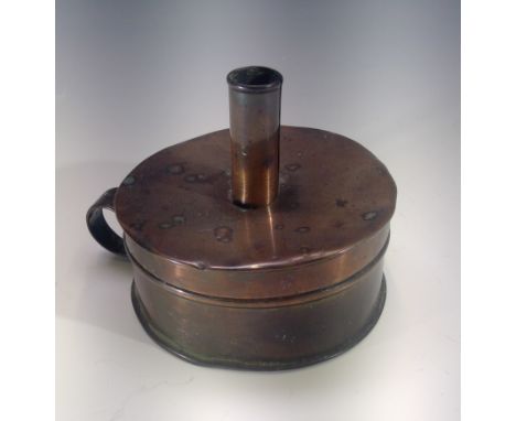 A late 19th century copper tinder box chamber stick. Height 10cm.