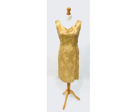 A Claire Layton yellow silk brocade fitted dress, size 38 label.Condition report: Very clean condition, no odours. Evidence o