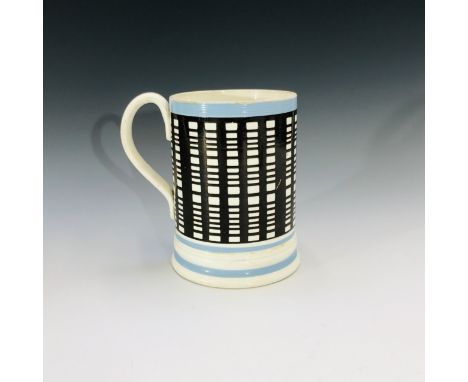 Large pearlware tankard, circa 1820, with blue painted bands and brown slip engine turning. Height 15cm.Condition report: Chi