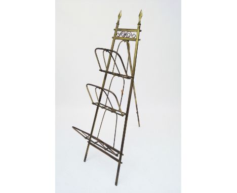 An Edwardian folding brass magazine rack, with easel support, height 130cm. (Qty: 1)