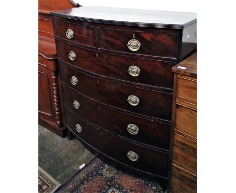 A mahogany bow front chest of drawers, 19th century, with two short and four long drawers, on splayed bracket feet, height 11