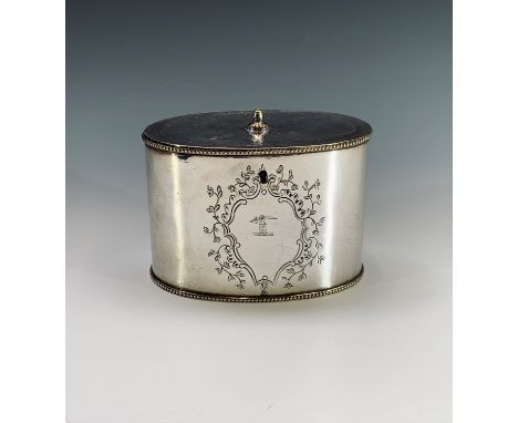 A silver plated tea caddy of oval form with chased decoration and engraved crest. Height 9cm, width 12.5cm.Condition report: 