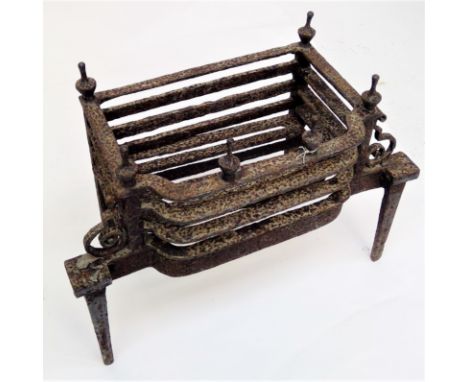 A Georgian iron fire basket, with urn shaped finials and scroll end supports, height 51cm, width 64cm, depth 31cm.Condition r