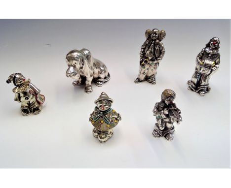 Three Magrino enamelled silver clown models two other silver clown models and a silver dog, maximum height 10cm