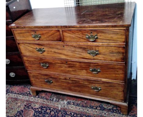 A Georgian mahogany chest of drawers, with two short and three long drawers on bracket feet.