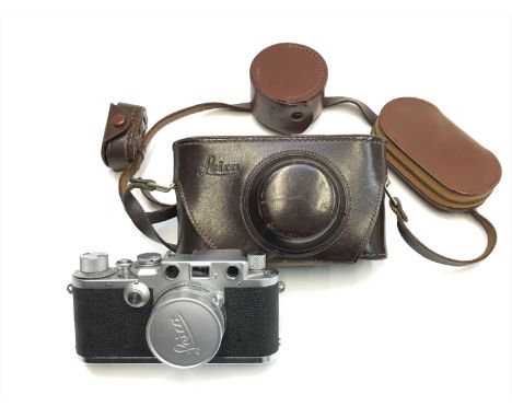 A Leica 11c camera, serial no. 446993, together with various accessories.Condition report: There are no dents or signs of dam