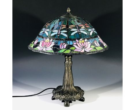 A large Tiffany design twin bulb table lamp, the shade decorated with dragonflies and water lilies. Height 58cm.