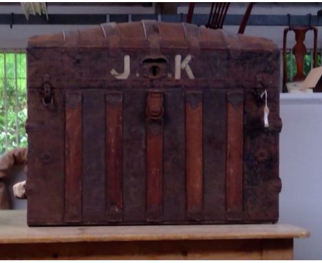 A domed top seaman's trunk, with nautical sailing ship stencilled to each end and initialled J.K, part of original Plymouth s