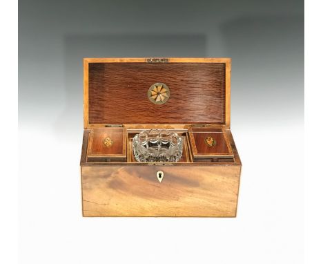 A late 18th/early 19th century tea caddy of Sheraton design, the inner lid and the two hinged interior compartments having ma