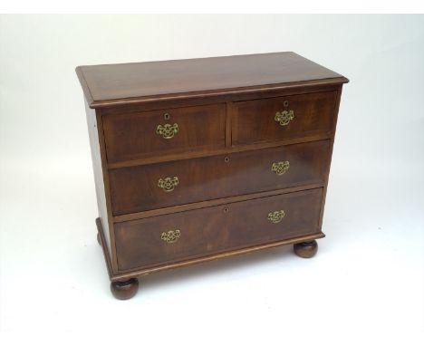 An 18th century style walnut chest of drawers, of small proportions, with two short and two long drawers, on bun feet, height