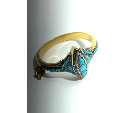 An historic and fine mid-19th-century high purity gold, hinged bangle presented by Queen Victoria, 1853. Set with a navette p