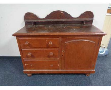 A Victorian pine sideboard fitted with cupboard and three drawers with shelf above 