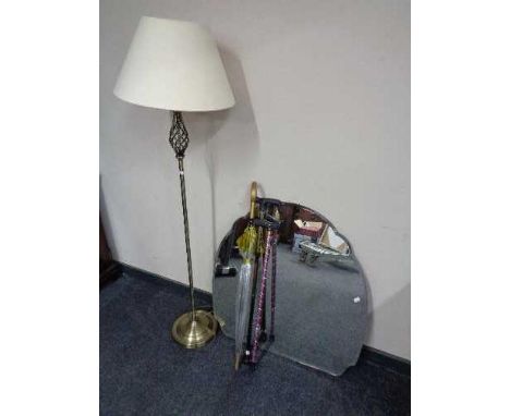 A frameless bevelled mirror, contemporary floor lamp with shade, parasol and two walking sticks 