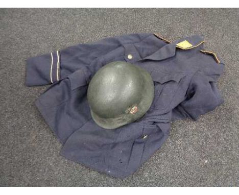 A WWII helmet with later decal and a German Air Force tunic 