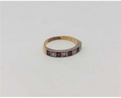 A ruby and diamond half eternity ring, 18CT size O.  CONDITION REPORT: Indistinctly stamped. 2.8g. 