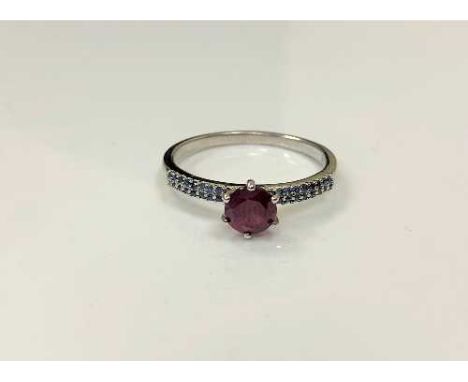 A silver synthetic ruby dress ring, size T