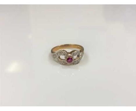 A 9ct gold diamond and ruby ring, size M/N