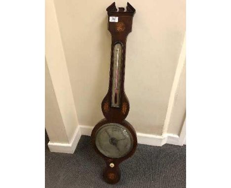 An early 19th century inlaid mahogany barometer with silvered dial