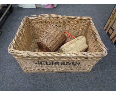 A large wicker hamper together with two baskets and Aldis projector 