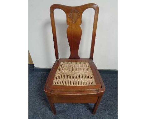 A mahogany bergere seated commode chair 