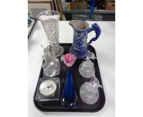 A tray of glass, quartz mantel clock, paper weight, dolphin figures, Continental embossed jug 