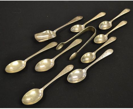 A pair silver bright cut sugar nips; a conforming caddy spoon; four conforming tea spoons; three coffee spoons, London hallma