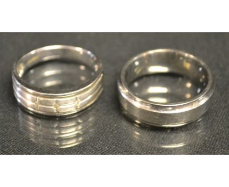 Rings - a gentleman's trilogy diamond accented 9ct gold signet ring, 4.9g gross; another titanium wedding band, (2)