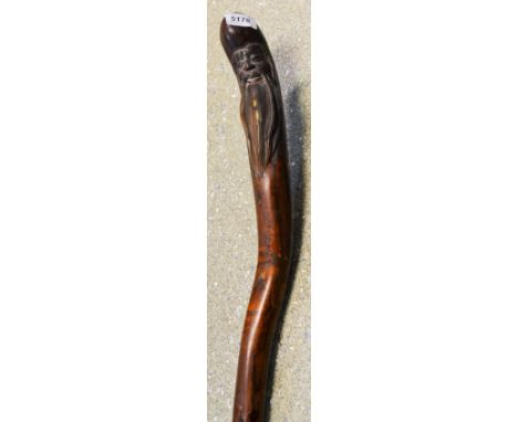 A Chinese carved walking stick, the terminal carved with an elder, 109cm long (modern)