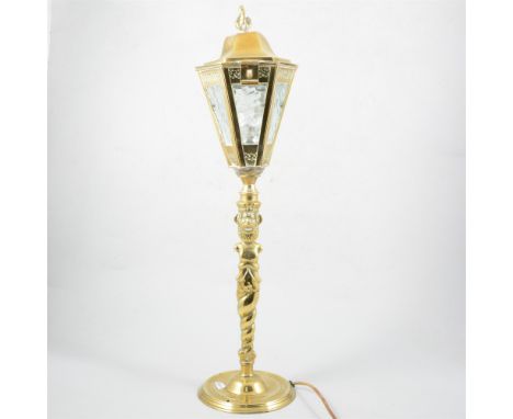 A brass table lamp in the form of a gas street light, 57cm high; and a carved oak cased barometer signed Bolt, Weymouth.