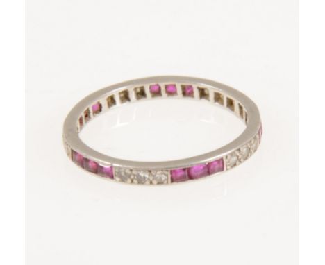 A ruby and diamond full eternity ring, alternating groups of three square cut rubies and eight cut diamonds, fifteen rubies a