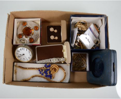 A quantity of costume jewellery, brooches, earrings, necklaces, a metal Goliath pocket watch in travel case, paste set cockta