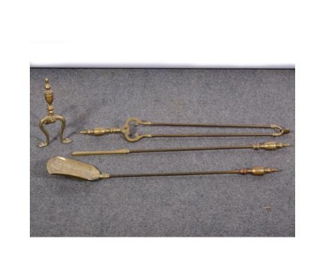 A set of three brass fire irons, urn finials, 72cms, and a brass andiron.