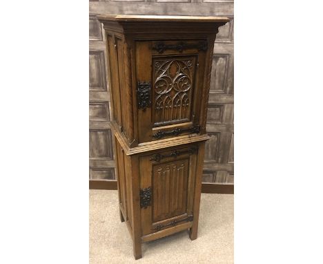 OAK FOOD CUPBOARD OF 16TH CENTURY DESIGN the moulded cornice with two cupboards below enclosed by Gothic carved panel doors, 