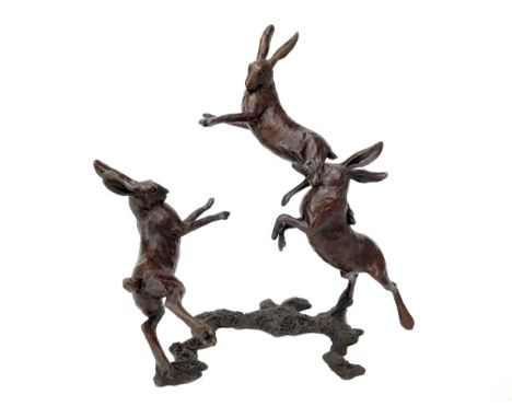 BOXING HARES, A BRONZE BY MICHAEL SIMPSON, modelled as three hares playing, on a naturalistic base, monogrammed and numbered 