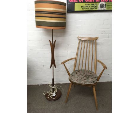 An Ercol stickback dining chair and a retro teal lamp