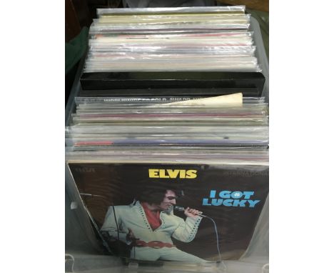 A box containing a collection of approx 80 plus Elvis Presley LPs.