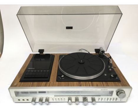 A Sanyo G3002 wooden and brushed metal stereo music centre comprising a record player, the turntable plays at both 33 and 45,