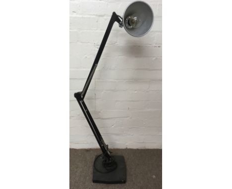 An floorstanding Anglepoise lamp on heavy base with adjustable arm and lipped shade, bearing name to arm.Approx 110cm extende