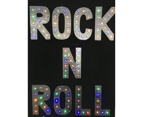 A hand made light up â€˜Rock n Rollâ€™ sign, approx 59cm x 79cm.