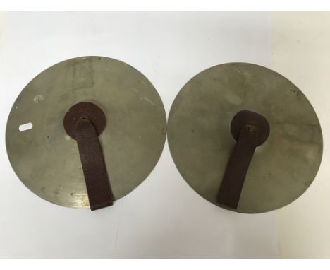 A pair of hand cymbals.